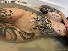 Tattoobabie looks hot rubbing her pink wet pussy