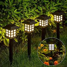 Tall, twisting iron post features a solar light on top that shines automatically at night. I62 Zr Gkq6wbm