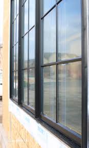 Once you clean, sand, and prime this was my second attempt at painting aluminum window frames. Black Steel Windows And Doors The Look For Less Remington Avenue