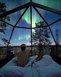 stay in a glass igloo and see the northern lights in finland dream vacations glass igloo hotel beautiful places to travel