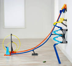 The hot wheels wall tracks are actually a specific special set from the well known brand of kid's toys hot wheels. Amazon Com Hot Wheels Track Builder Vertical Launch Set 50 Inches High 3 Stunt Configurations Ages 6 To 10 3m Command Strips Amazon Exclusive Toys Games