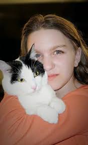 Sweet Stinky snuggling her squeaky toy in anticipation of the pending  tropical storm.