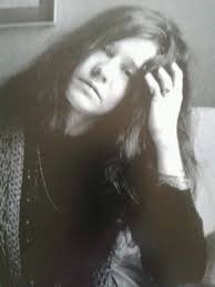 Singer janis Joplin in a pensive mood.