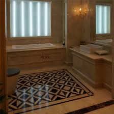 White bathroom floor tiles with small black insets can effectively ground the floor space, keeping it distinct from white walls. China Bathroom Floor And Wall Design Water Jet Black And White Marble China Marble Medallion Flooring Marble Floor Medallion