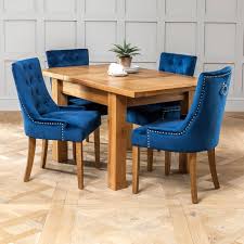 This stylish modern extending black glass dining table and 4 faux leather chairs consists of a black glass dining table top with elegant shaped chrome table legs and will clearly be. Solid Oak Small Extending Table 4 X Blue Velvet Scoop Chairs The Furniture Market