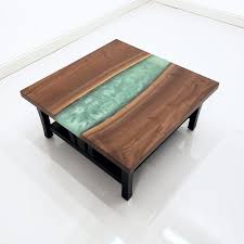 High caliber coffee table the high caliber coffee table is an innovative way to store jewelry firearms cash documents or any valuables in what appears to be an ordinary coffee table. Walnut Epoxy River Coffee Table Resin River Table River Coffee Table With Epoxy In Pa Country Lane Furniture