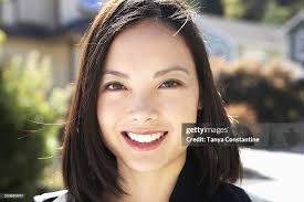 Filipino Woman Smiling Outdoors High-Res Stock Photo