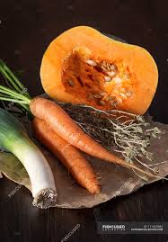 Don't try this at home, kiddies. Close Up Of Fresh Picked Carrots With Dried Herb Leek And Pumpkin Nutrition Healthy Eating Stock Photo 171423384