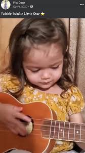 2 year old Mia singing while playing the ukulele #throwback #miacupp