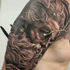 Black And Gray Realism Tattoo Of Zeus With Lightning Coming From The Eyes On The Right Arm Zeus Tattoo Greek Tattoos Realism Tattoo