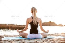 Back View Of A Young Woman Sitting In Lotus Position Lotus Position Yoga Poses Photography Meditation Poses