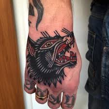 Traditional Wolf Tattoo On Hand Traditional Hand Tattoo Wolf Tattoos Wolf Tattoos Men
