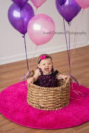 The flipside of this is that good family photographs are, by their very nature, relatively unposed. One Year Old Girl Birthday Indoor Photo Shoot With Balloons And Her In A Basket Www Fa Baby Birthday Photoshoot 1st Birthday Photoshoot Birthday Girl Pictures