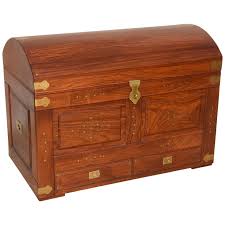 Premium quarter sawn white oak constructed into destinctive peg corner design, complimented with supple ostrich leather top. Anglo Indian Domed Camel Back Trunk In Teak Wood With Inset Brass And Hardware For Sale At 1stdibs