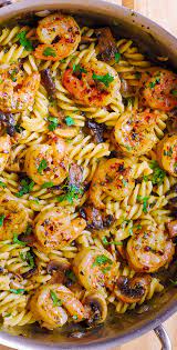 Pesto Shrimp Mushroom Pasta Is A Perfect Summer Dinner Recipe This Is A Mediterranean Pasta Dish That Will Summer Recipes Dinner Pasta Dishes Seafood Dinner