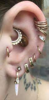 Read blog post about modern boho interior design by wanderlust & check out the best design ideas! Boho Ear Piercing Ideas For Women Cartilage Helix Rings In Gold Daith Jewelry Multiple Combinations Silver Bar Earrings Silver Crystal Earrings Heart Jewelry