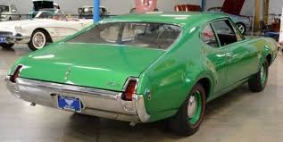 Image result for Scaraba Green 1930 Oldsmobile