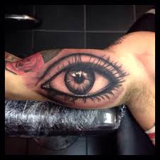 It symbolizes an open mind: Realistic Eye Tattoo On Muscles By Paul Priestley
