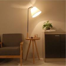 The rubber feet ensure that the lamp has a. China Leden Modern Wooden Floor Lamp With Side Table Tripod Stand Lighting China Wood Tripod Floor Lamp Floor Lamp With Shelves