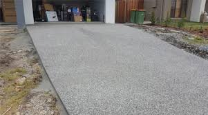 On an exposed aggregate driveway, colorful stones are laid on top of wet concrete to add a decorative, unique touch. Exposed Aggregate Archives Walker Concreting Resurfacing
