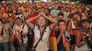 A german football fan looks on at the fanmeile (fan zone) next to berlin's brandenburg gate during the euro. Abrupt End To German Football Fest Bbc News