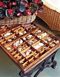 Coffee table with shells under glass. Display Table Ideas For Shells Beach Finds Coffee Tables Accent Tables Coastal Decor Ideas Interior Design Diy Shopping