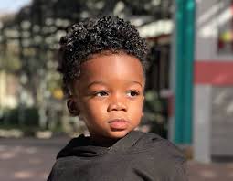 The curls are cut short and then swept to aside to give off energetic and funky vibes. 80 Popular Little Boy Haircuts Add Charm In 2021