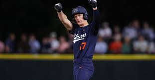 Auburn baseball team gathering at home plate