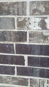 Wet brick before acid application. How To Clean Brick For Interior Or Exterior Walls