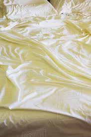 Make a colour popping addition with yellow bed sheets including refreshing floral designs to liven up your space. Rippled And Creased Yellow Bed Sheets On A Queen Size Bed Stock Photo Dissolve