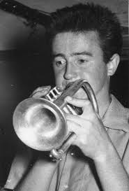 JOHN SANGSTER by Eric Myers* ohn Sangster squints and beams through his t