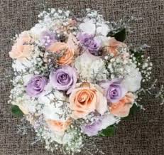 Peach ranunculus, blush roses, and white peonies comprise this gorgeous summertime wedding bouquet by splints and daisies. Pastels Pop Wedding Bouquet In Elkton Md Fair Hill Florist