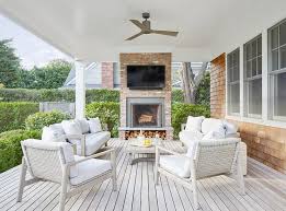 Fire in outdoor fire pit. White Brick Outdoor Fireplace Design Ideas