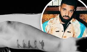 Take a look at drake's entire tattoo collection in the gallery below, then let us know your thoughts on his body of work in the comments section. Drake Gets Tattoo Of Himself Walking In Front Of The Beatles After Topping The Band In The Charts Daily Mail Online
