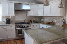 Maybe you would like to learn more about one of these? This Kitchen Features Coast Green Granite Countertops And Classic White Cabinetry The Taupe Green Granite Countertops Cheap Kitchen Cabinets Kitchen Cabinets