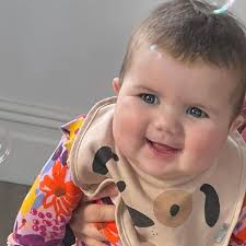 Woman, 70, charged over death of baby hit by car outside hospital