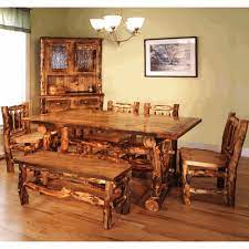 The 40'x40' log dining table with pedestal features a birch top with log edging and a log pedestal base. Colorado Reclaimed Wood Aspen Log Dining Table