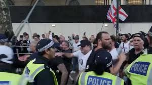 People have thrown flares towards the gates of Downing Street at a protest  in the wake of the Southport knife attack and riot
