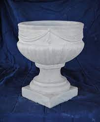 The arrangement comes in a plastic vase for all types of weather. Concrete Planters Mayse Mfg Co Outdoor Products