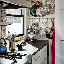 If you don't have the cupboard space and don't want to hang your pots and pans overhead, the island is a good solution. 12 Wall Pot Racks For Short People Kitchn