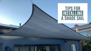 They used the metal fence poles to anchor the sails. How To Install A Shade Sail With Diy Cable Railing And A Few Tips To Make It Go Smoothly Tutorial Youtube