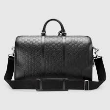shop the gucci signature leather duffle by gucci a carry on duffle with a secure zip and key lock closu leather duffle designer duffle bags leather duffle bag