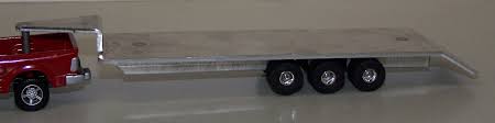 If you want to consider buying your child a toy truck of some kind, a. St411 1 64 24 Triple Axle Gooseneck Flatbed Trailer Action Toys
