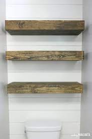 A cabinet or shelf above a toilet should be about 2 feet above the tank. How To Build Bathroom Floating Shelves For Extra Storage