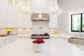 A white and light gray tile backsplash can add a nice accent piece to this countertop. 16 Backsplash Ideas Perfect For White Kitchens