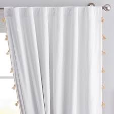Choose a rug in a similar pattern and design as the curtains if possible, to tie those pieces together for a balanced look. Tassel Blackout Curtain 108 Gold Pottery Barn Teen