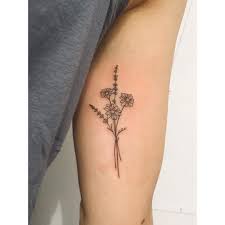 One of the most popular places for women to place flower tattoos is on the lower back. Tiny Daisy Lavender Bunch Lavender Tattoo Tattoos Bouquet Tattoo