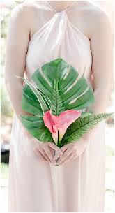 From elegantly simple to dreamily exotic, your tamarindo wedding flowers can be whatever you wish. Palm Frond Bouquet Tropical Beach Wedding Pink Bridesmaid Dress Pink Calla Lilies Bridal Bouquet Summer Simple Bridal Bouquets Tropical Wedding Bouquets