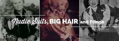 The hair is slicked back with a lot of product. Nudie Suits Big Hair And Fringe The George Jones