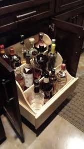 liquor storage at wet bar base cabinet
